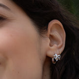 Bow and Tell Huggie Hoops - Platinum